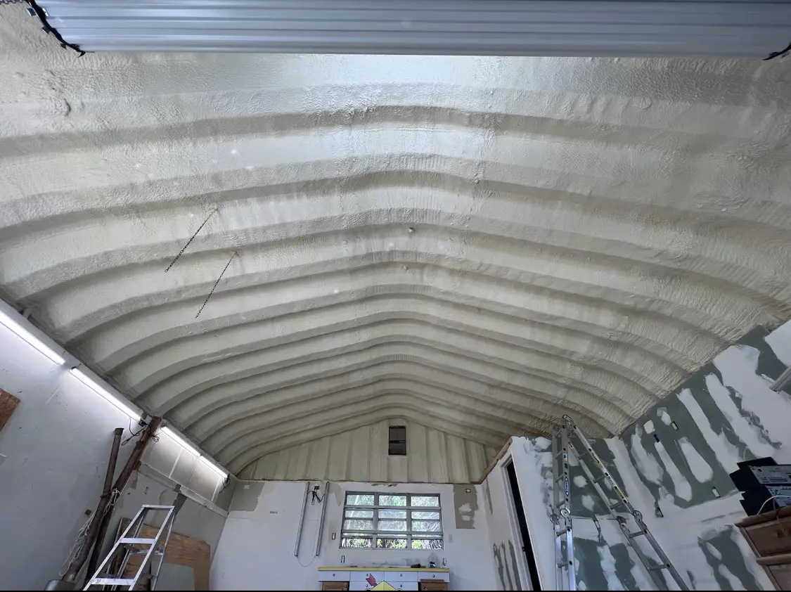 Spray polyurethane foam applied to the underside of a metal roof deck in Beardstown